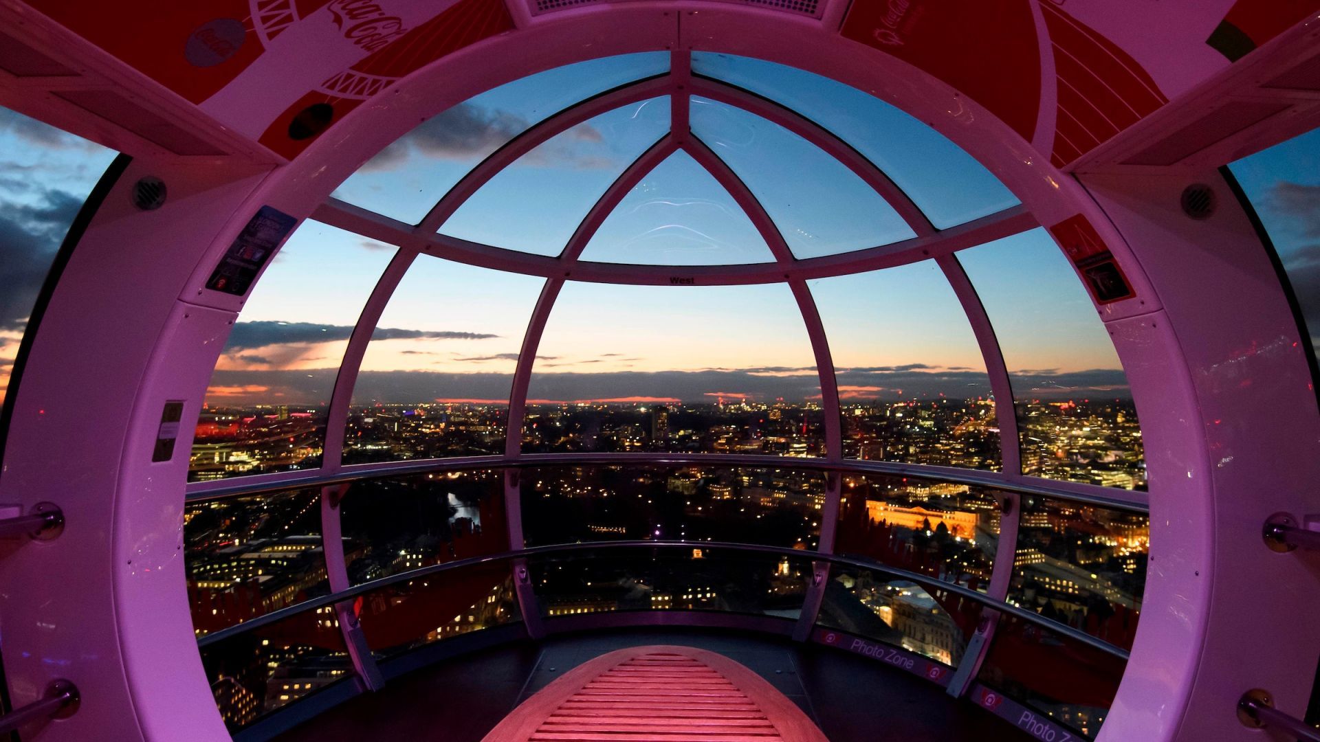 Visitors enjoying the view from a London Eye capsule