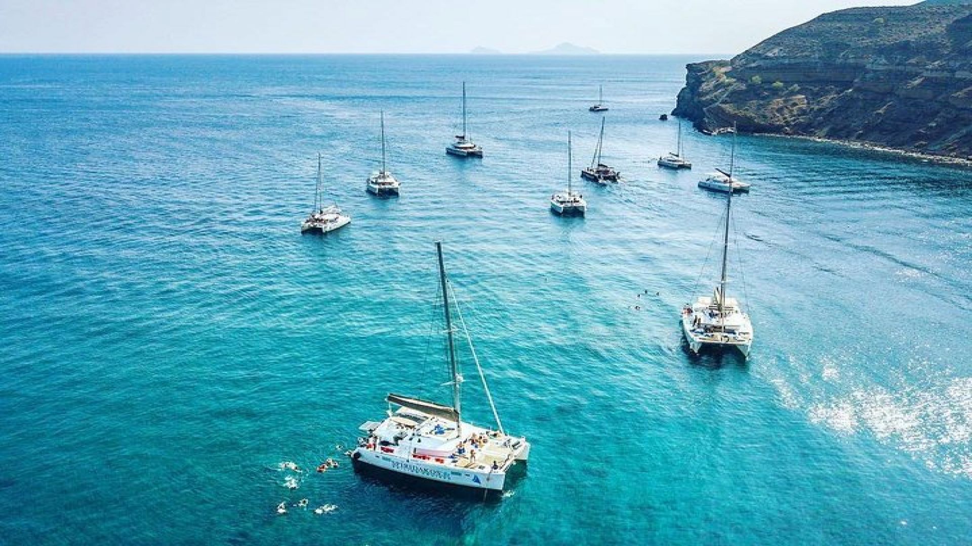 Santorini Classic Catamaran Cruise with BBQ, Drinks and Transfers
