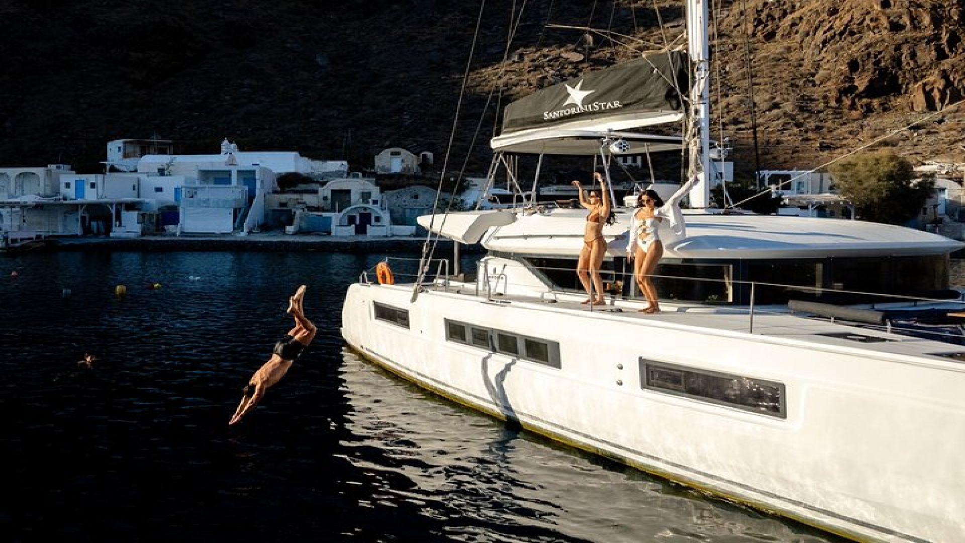 Half-Day Exclusive Catamaran Cruise in Santorini with Meal and Open Bar