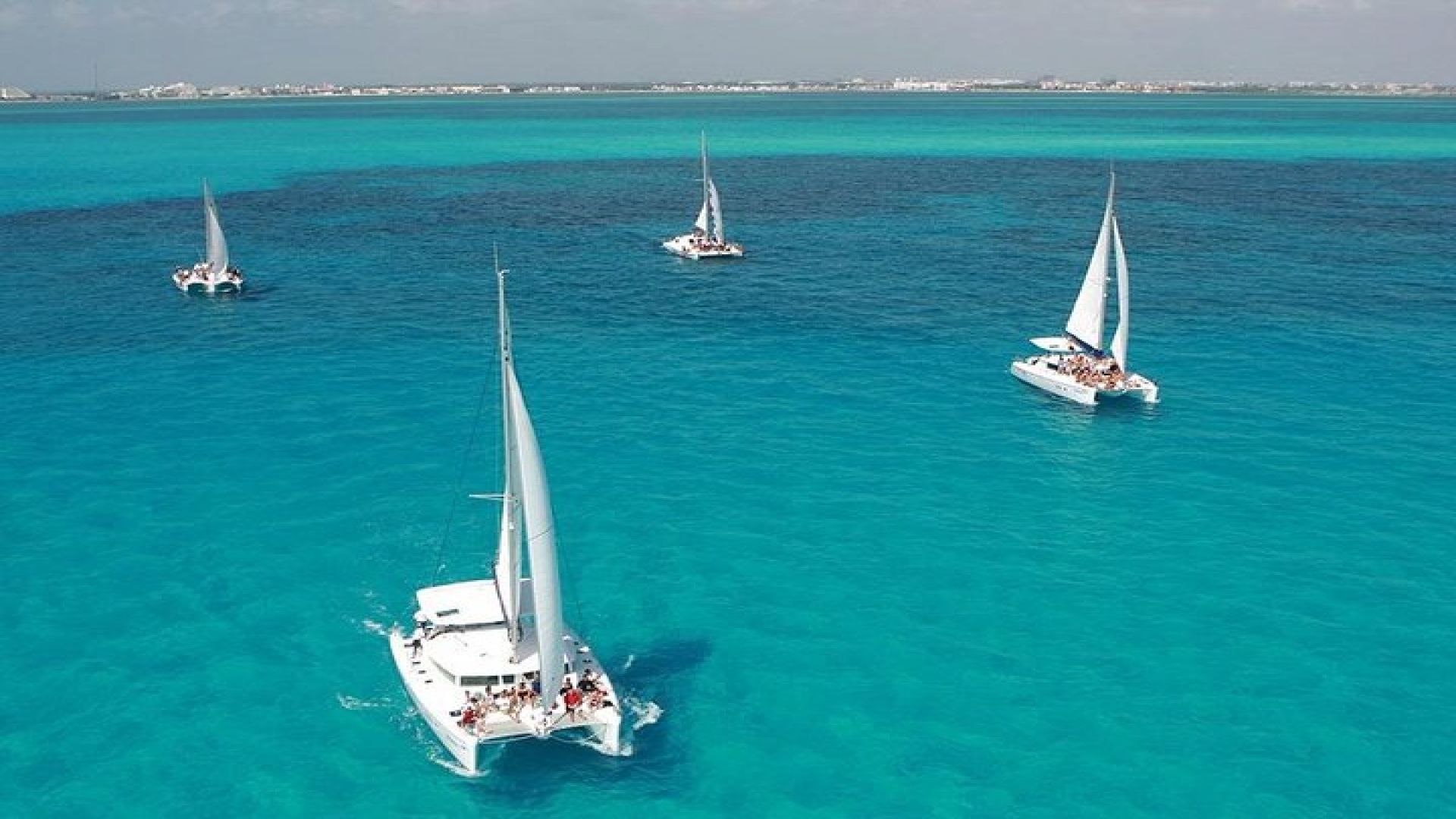Catamaran adventure to Isla Mujeres with Snorkel,Buffet,Open Bar and Beach Club